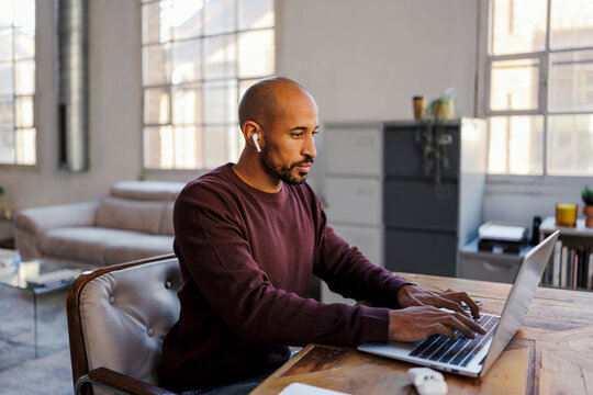 Man working remotely at bright office