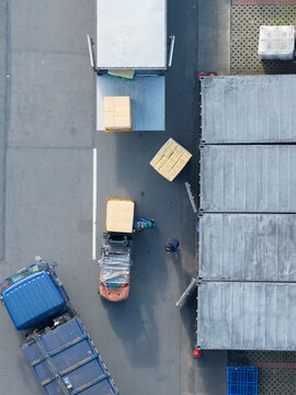 Aerial View of Warehouse Loading Dock with Cargo Trucks