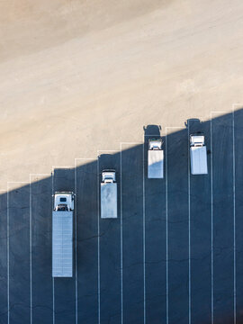 Aerial View of Delivery Trucks at Logistics Center Parking Lot