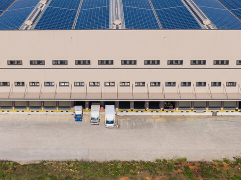 Logistics Warehouse with Solar Panels and Loading Docks Aerial V
