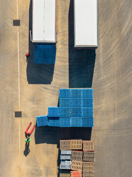 Top Down Aerial View of Logistics Yard and Trucks
