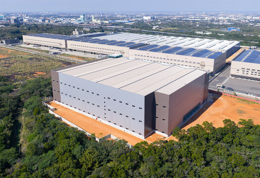 Aerial View of Solar-Powered Logistics Warehouse