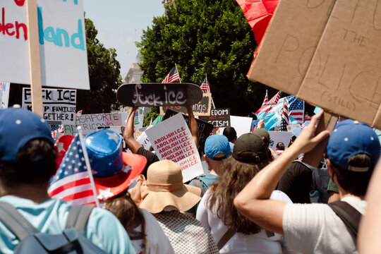 Protesters March Holding Anti Ice Signs 