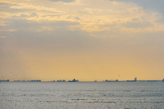 Cargo ships on the sea at sunset