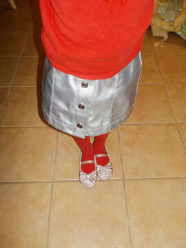 A silver skirt and sparkly shoes