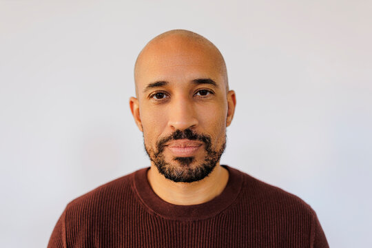 Man looking at camera on white background