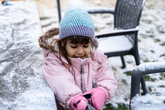 Child Playing With Snow