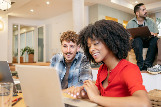 Diverse team collaborating in a modern coworking space