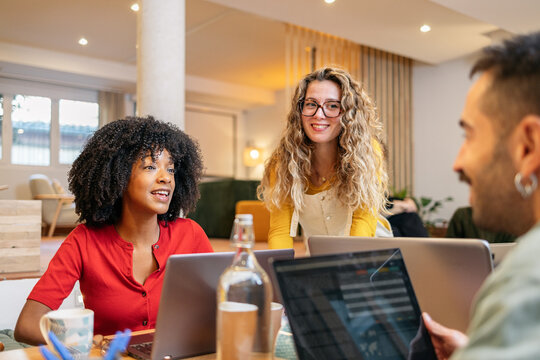 Diverse team collaborating in a modern coworking space