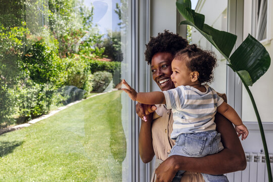 Mother and child enjoying a moment by the window