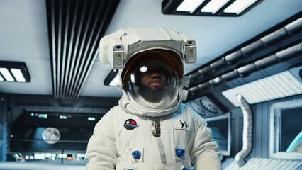 Scientist wearing helmet walking in cutting edge spaceship, doing cosmic voyage in solar system....