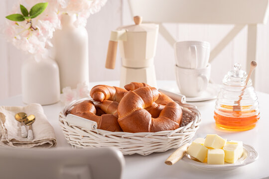 Fresh and homemade croissants served with coffee.