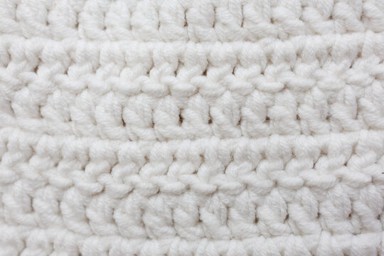 White crochet fabric with double crochet stitches worked in rows turning method textured handmade pattern