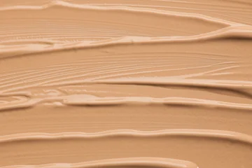 Foundation, concealer, face makeup smudge background, samples, beige smears backdrop. Cosmetic liquid foundation or cream beige color smudges, stroke. Contouring, Make up. Foundation texture, make-up  © Subbotina Anna
