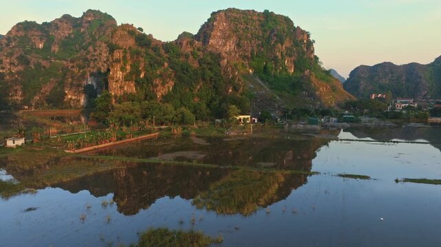 Aerial view of Hang Mua, Ninh Binh, Vietnam, showcasing the stunning limestone karsts and rice paddies. A popular tourist destination for its natural beauty.