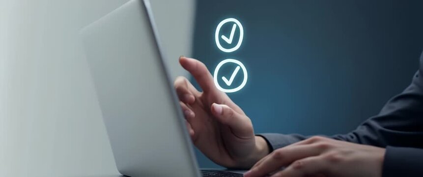 Business professional using a laptop, hand gesturing towards digital checkmarks, in a sleek, modern office; camera pans slowly, ambient light flickers subtly, creating a cinematic technology ambiance.