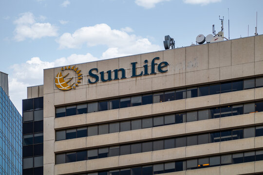 Calgary, Alberta, Canada. March 2, 2026. The Sun Life Financial logo and signage on the exterior of a corporate office building downtown.