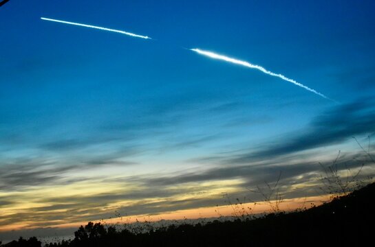 Space X rocket launch over sunset sky in Vandenberg Air Force Base California 
