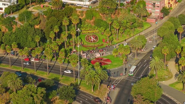 Aerial view of the tourist area around the flower clock in Vi&ntilde;a del Mar, with many tourists and heavy traffic on a sunny day, Chile