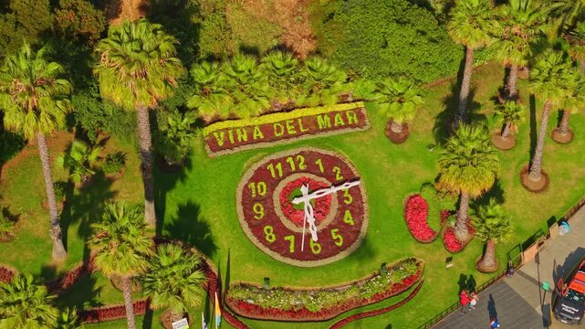Bird's-eye view establishing shot of the flower clock in Vi&ntilde;a del Mar, Chile, on a sunny day, being directly illuminated by the sun's rays.