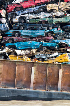 Canada, BC, Barge loaded up with flattened automobiles.  Going to scrap metal recycling yard.
