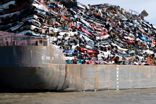 Canada, BC, Barge loaded up with flattened automobiles.  Going to scrap metal recycling yard.