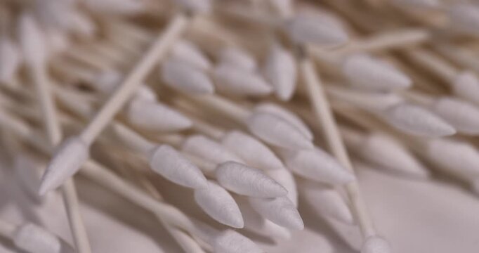 cotton swabs made of natural cotton and sticks made of paper, sticks with pieces of natural cotton wool for personal hygiene and facial care and makeup