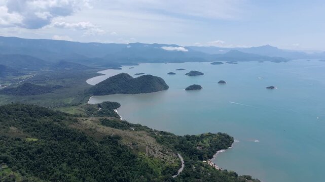 Paraty, Brazil - A Sweeping Coastline With Emerald Hills and Scattered Islands Curves Into the Sea - Aerial Drone Shot