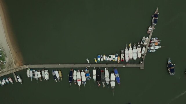 Colorful Wooden Boats Anchored On The Pier In Historic City Of Paraty In Brazil. Aerial Topdown Shot