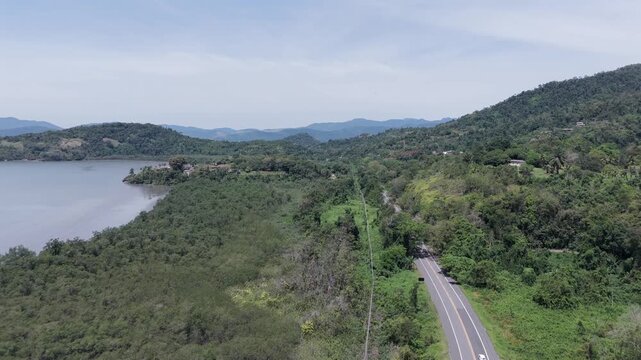 Road Through Lush, Forested, Mountainous Landscape In Paraty, Brazil - Drone Shot