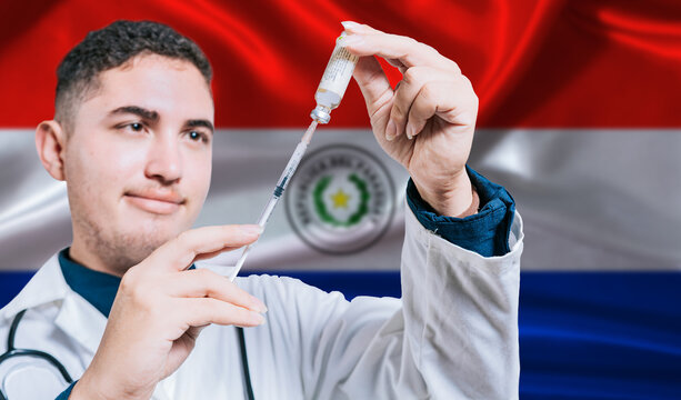 Doctor holding syringe on Paraguay flag background. Medical professional holding syringe with Paraguayan flag in the background