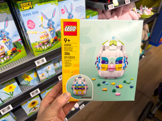 Fototapeta premium LEGO Easter Basket Building Set Toy Held in Hand in Retail Store Aisle