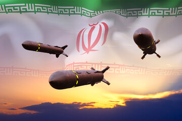 Naklejka premium Missiles with Iran flag against the sunset. Bomb, chemical weapons, missile defense, a system of salvo fire