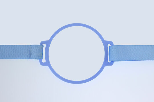 Blue adjustable nylon with plastic head strap frame, isolated on white background used for head mounted magnifier or inspection equipment. Providing comfortable support for magnifying tools devices