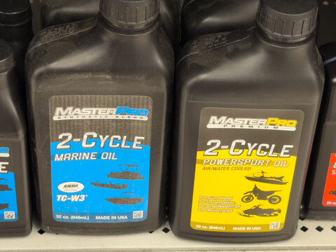 MasterPro 2 Cycle Marine Oil and Powersport Oil Bottles on Auto Parts Store Shelf