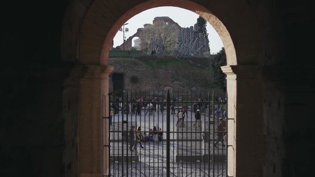 Tourists people visiting interior the Colosseum and Roman Forum, one of the seven wonders of the world Unesco Heritage