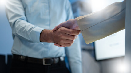 Close up of a real estate agent and client shaking hands for a successful home insurance deal or...