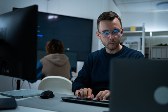software engineer or programmer team working late in development office,problem solving or algorithm of ai assistant,ai agent helping for work.software developer,digital technology security concept