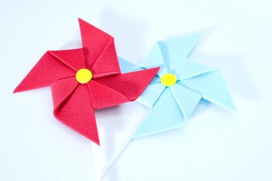 Handmade red and blue wind whell paper isolated on white background.