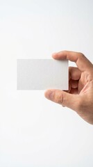 Obraz premium Hand holding a blank white card on white background