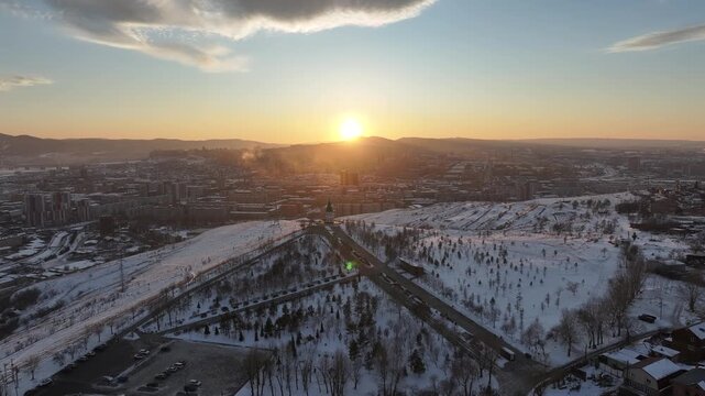Winter sunset in Krasnoyarsk. Paraskeva Pyatnitsa Chapel on Karaulnaya Mountain.