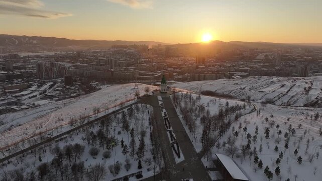 Winter sunset in Krasnoyarsk. Paraskeva Pyatnitsa Chapel on Karaulnaya Mountain