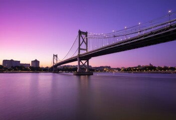 Obraz premium Modern steel bridge illuminated during the magic hour