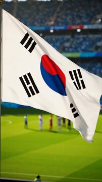 South Korean Flag Waves Proudly Over Soccer Stadium Crowd.