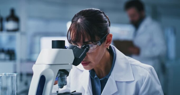 Glasses, microscope and science with woman in laboratory for development or investigation. Analysis, medical sample and research with mature scientist at work on clinical trial or experiment