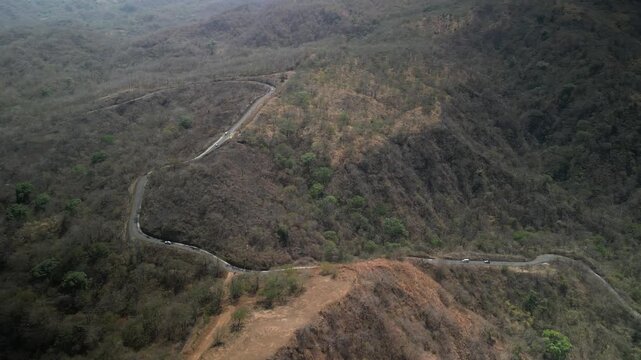Aerial of twisty mountain road near Nuevo Colon Costa Rica in dry hillsides