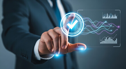 Fototapeta premium Man pointing finger at check mark on digital screen with data charts and network lines in business setting