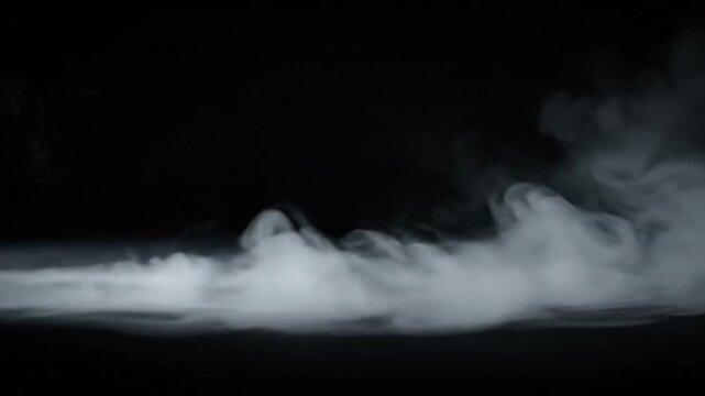 Abstract atmospheric white smoke billows and spreads across a profound black background, evoking a sense of mystery and depth, suitable for creative visual effects and conceptual art