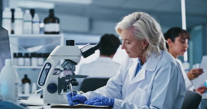 Science, innovation and woman with microscope, lab and research for mRNA vaccine and pharmaceutical. Scientist, writing and serious for HIV cure development, biotech and mature person with notebook