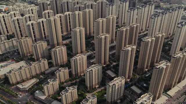 Dense urban residential buildings in China, high-rise apartment towers and compact city architecture in a densely populated urban area.